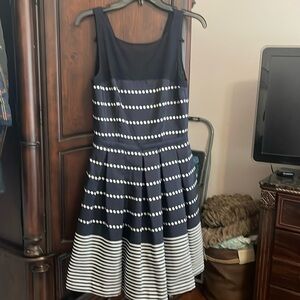 Ladies navy polka dot and striped dress with sheer top
